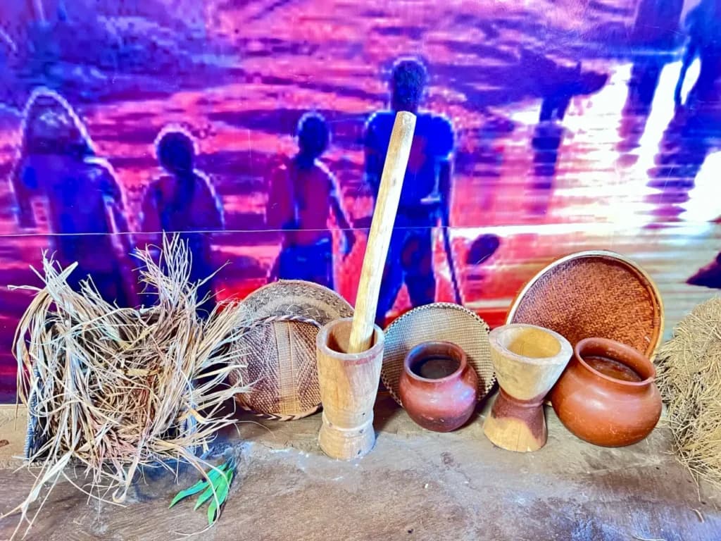 Clay pots, woven baskets and a wooden pestle