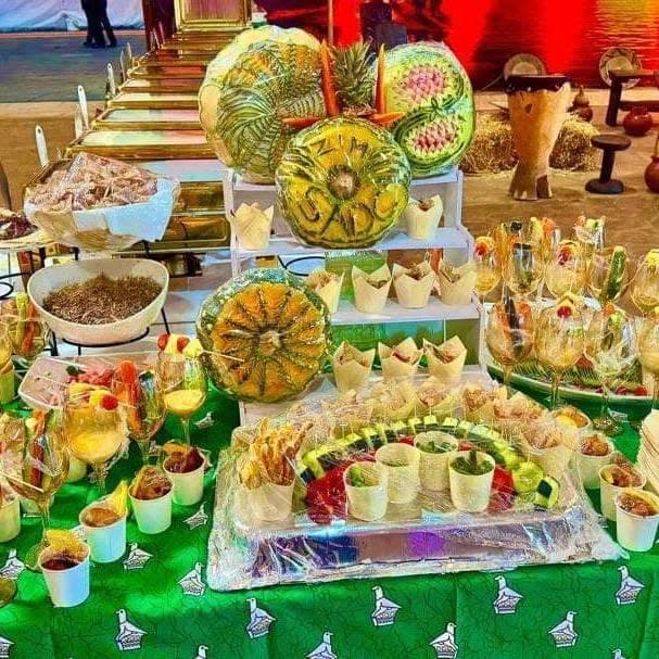 A catering display of canapes and carved fruit