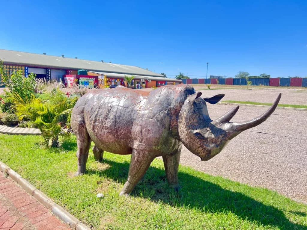 A rhino sculpture on the lawn
